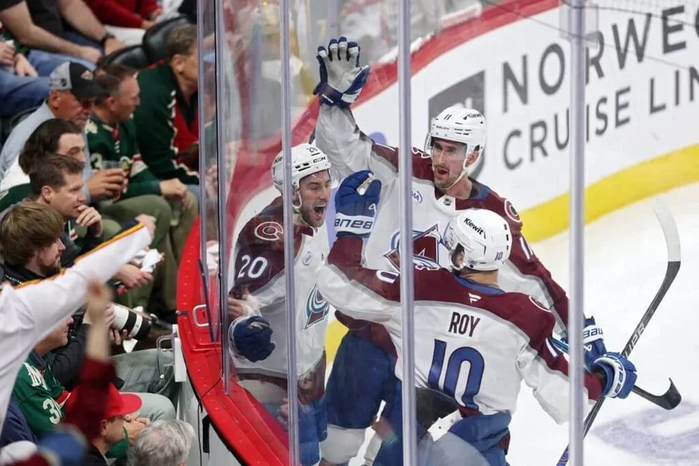 Ross Colton #20 of the Colorado Avalanche celebrates with Brock Nelson #11 and Nicolas Roy #10